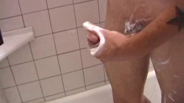 As Dan takes a shower he soaps down his wet naked body, working up a good lather and nice big boner. After edging himself a few times, he's squirting out a monster cum gusher.