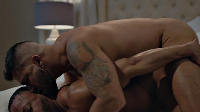 Bottom BBC barebacked by inked stud in doggy on bed