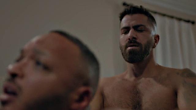 Bottom BBC barebacked by inked stud in doggy on bed