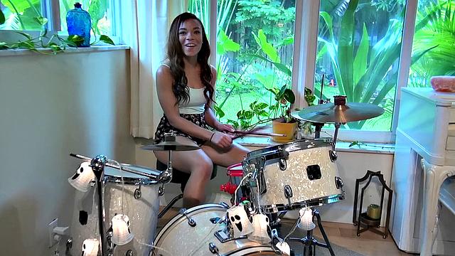 Curly-haired babe bounces her ass on a hard dick in the living room