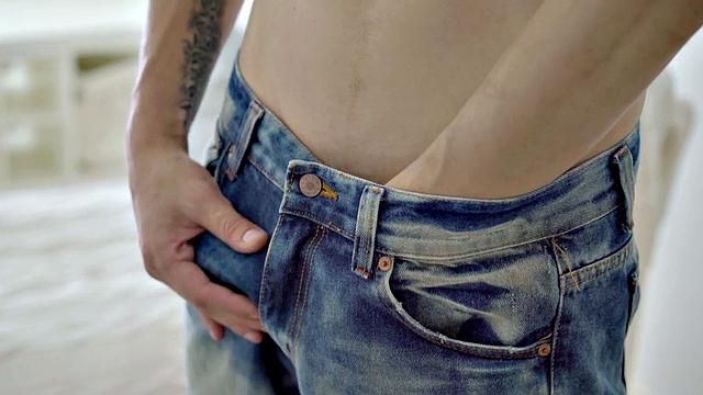 A hot athletic twink tease and tug on a huge cock while flaunting his ink