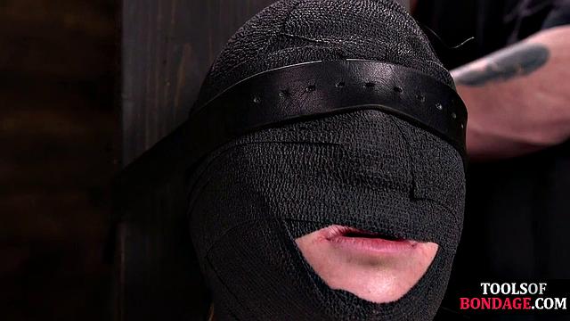 Masked BDSM babe tied up by master in his sex room
