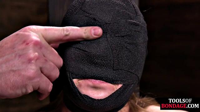 Masked BDSM babe tied up by master in his sex room