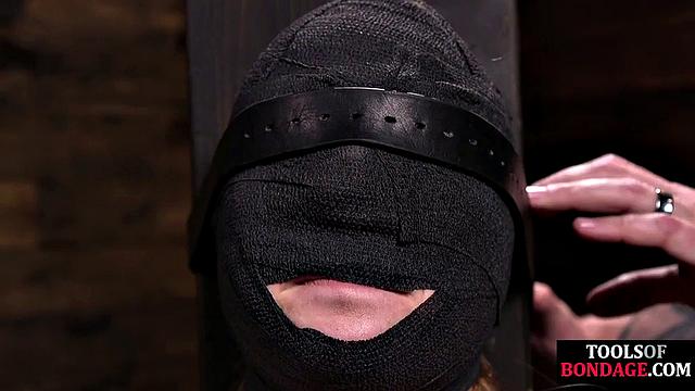 Masked BDSM babe tied up by master in his sex room