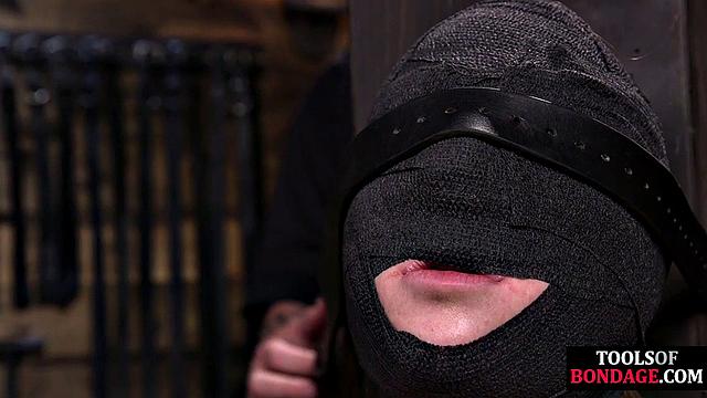 Masked BDSM babe tied up by master in his sex room