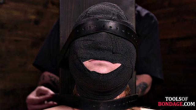 Masked BDSM babe tied up by master in his sex room