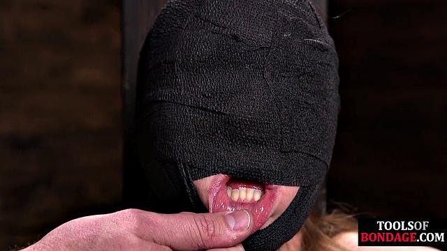 Masked BDSM babe tied up by master in his sex room