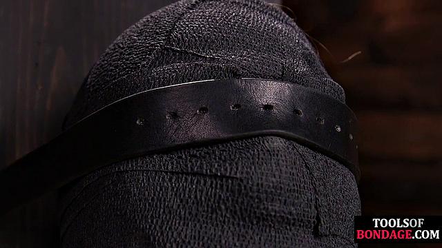 Masked BDSM babe tied up by master in his sex room