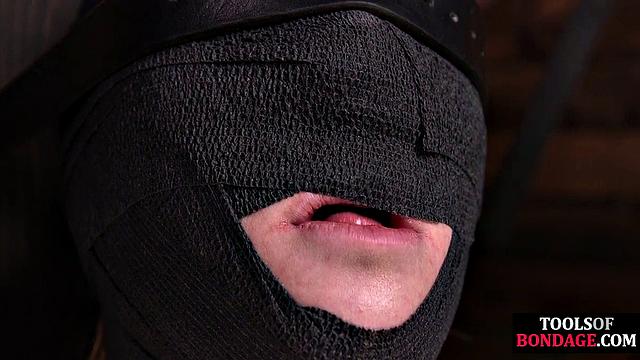 Masked BDSM babe tied up by master in his sex room