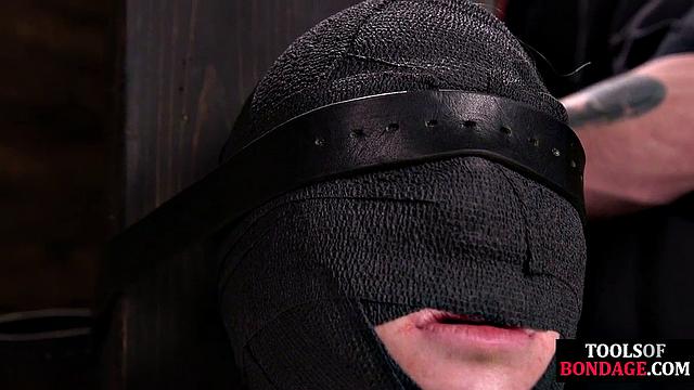 Masked BDSM babe tied up by master in his sex room