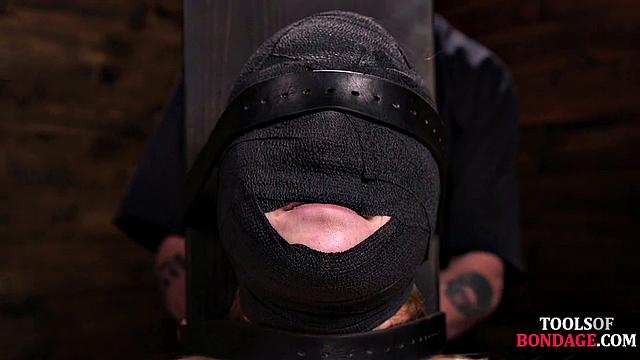 Masked BDSM babe tied up by master in his sex room