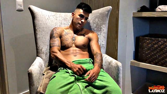 Our featured solo boy of the week is inked and muscular Erick. Wrapped in a towel, the young Latino parks his ass in a chair and teases us before getting naked.