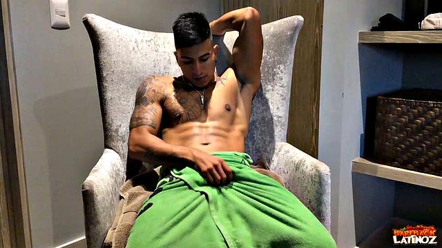 Our featured solo boy of the week is inked and muscular Erick. Wrapped in a towel, the young Latino parks his ass in a chair and teases us before getting naked.