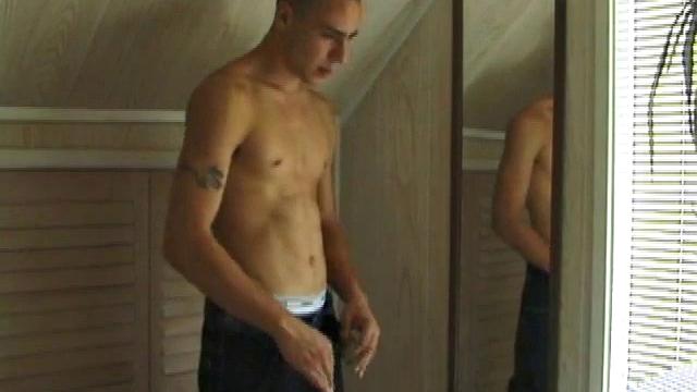 This tattooed hottie wants us to watch him jerk off. Bradley comes in and immediately takes charge of the task at hand. He starts a porn video, lubes up his dick and strokes out a healthy cum load all over mirror.