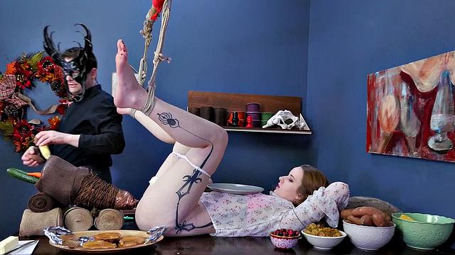 Watch Jessica Kay's ass get plugged and her mask ripped off while she dominates in kinky food play