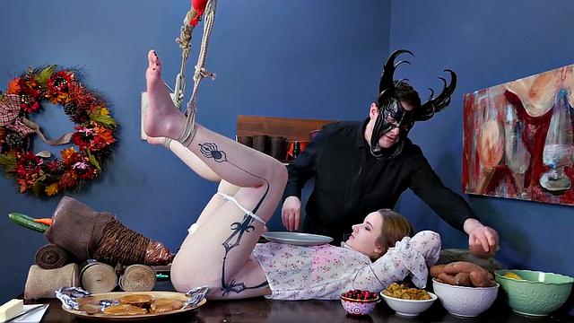 Watch Jessica Kay's ass get plugged and her mask ripped off while she dominates in kinky food play