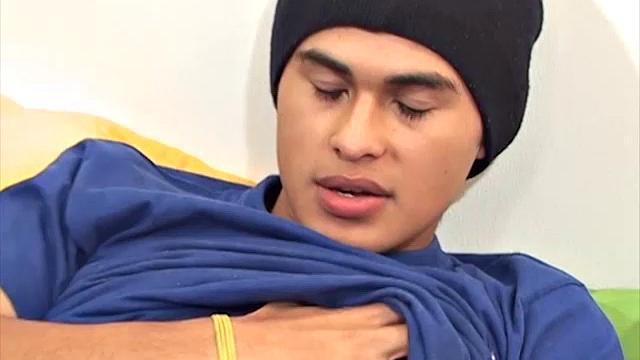 This cute and silky smooth Latin twink, with the eyes, pushes his pants down, and it's obvious he's packing a big one. Alfredo pulls that monster dick out of his boxer briefs and starts stroking.