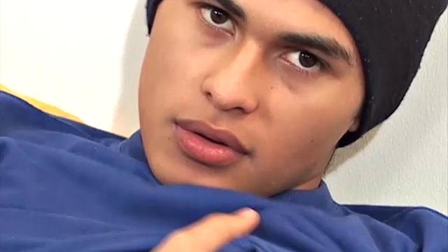 This cute and silky smooth Latin twink, with the eyes, pushes his pants down, and it's obvious he's packing a big one. Alfredo pulls that monster dick out of his boxer briefs and starts stroking.