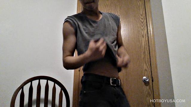 Raul Mendez is a slim and smooth Latin twink, with a buff body and fine little butt. Once naked, he grabs hold of his dick and begins working it stiff.