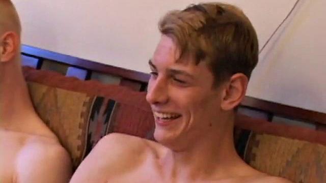 Richard, Kaos and Skylerr turn on some porn and start grabbing their crotches, before stripping naked. After passing the lube around they stroke their boners.