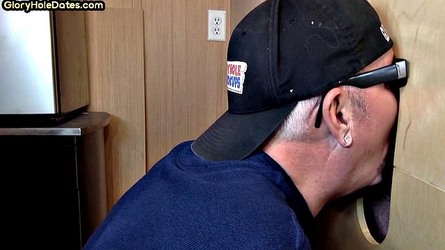 Senior gloryhole DILF blows BF's dick through hole