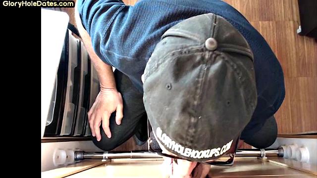 Senior gloryhole DILF blows BF's dick through hole