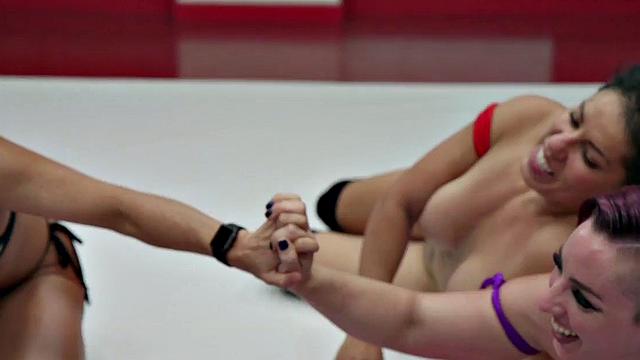 Hot lesbian wrestling MILFs get roughed up in a pussy fingering frenzy on the floor