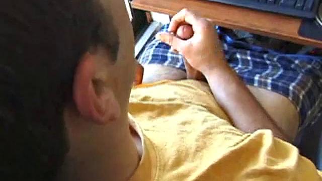 Young Tony returns for another solo session and after pulling off his pants he strokes up a stiff one, while watching some on his computer. After jacking off with determination, Tony strokes out another messy cum shot