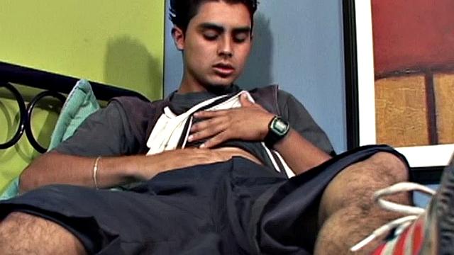 We join Latin twink Antonio, on his back and working up a stiff one. With his pants off, and shirt pulled up, he lets his hard cock poke out of the waist band of his underwear. Then the horny boy gets totally naked and starts stroking with determination.