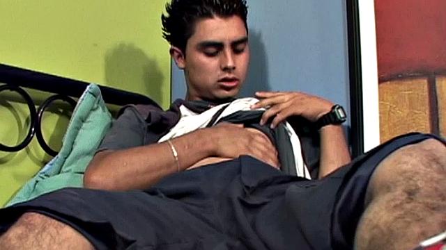 We join Latin twink Antonio, on his back and working up a stiff one. With his pants off, and shirt pulled up, he lets his hard cock poke out of the waist band of his underwear. Then the horny boy gets totally naked and starts stroking with determination.
