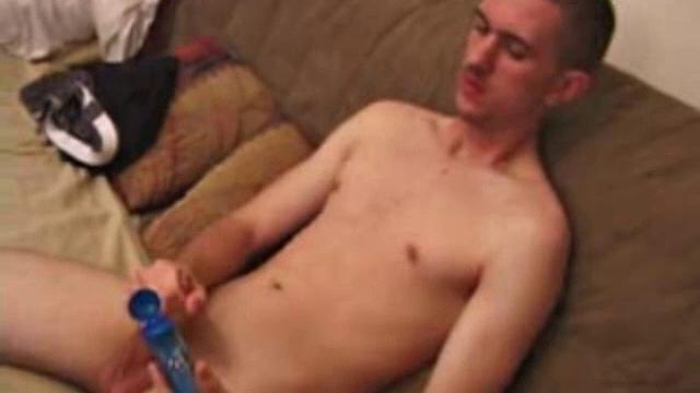 On a rainy day, Casper Cox watches a porn video while stroking his cock. After lubing his meat, he works it awhile, before lubing up a jelly dildo and pleasuring his asshole with it.