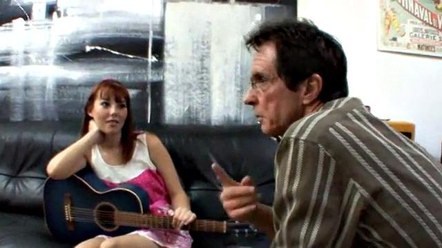 Teen banging oldie in music lesson scene