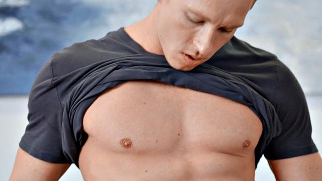 Handsome jock masturbating with two hands in session