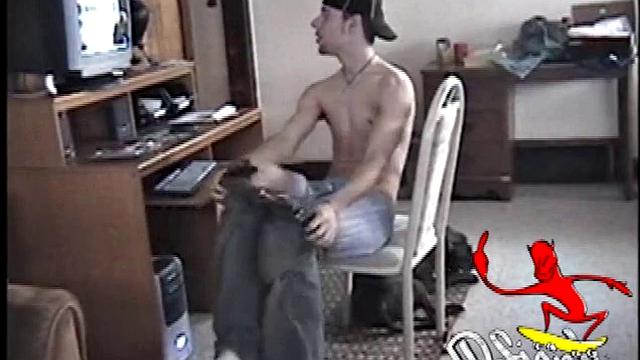 Shadow plants himself in front of the computer, starts stroking his dick to the porn video playing. As he works the keyboard and mouse he massages his cock and in no time the young man is pumping cum on his six pack