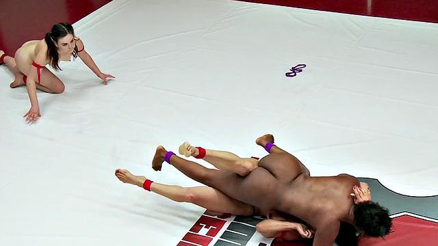 Multi-ethnic wrestlers fight in public on the mat