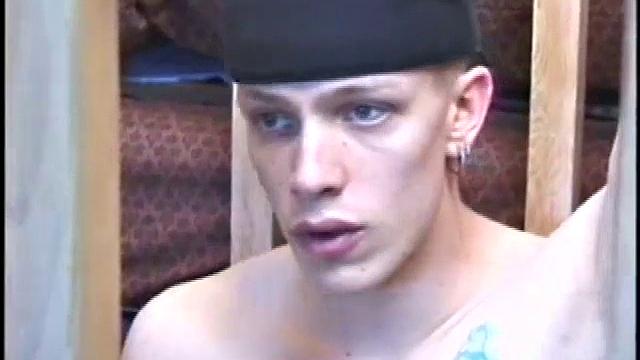 Dressed in baggy shorts and a baseball cap, popular Shane stands halfway up the stairs, watching his porno and talking about making the wall the target for his cum shot.