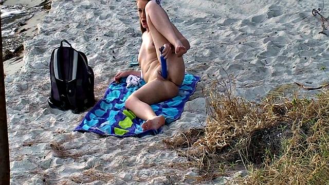 Ashlyn Lee goes fishing, but she enjoys a masturbation session on the sand. She