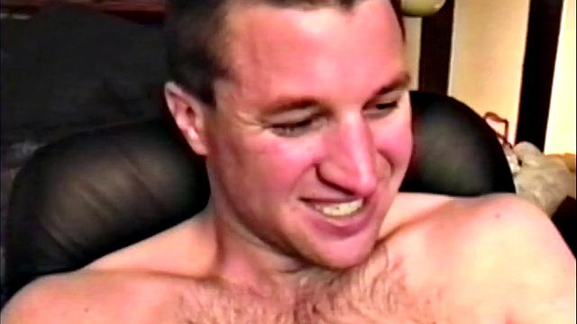 We look in on Brandon seated at the computer, as he pushes his pants down just enough to release his junk. By the time this hairy young man is stiff, the shirt is removed and he's jerking off. Once totally naked, Brandon strokes with determination.