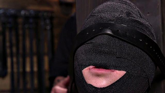 Gagged submissive clamped and caned while bound by master