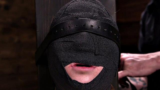 Gagged submissive clamped and caned while bound by master