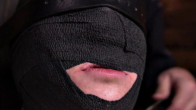 Gagged submissive clamped and caned while bound by master