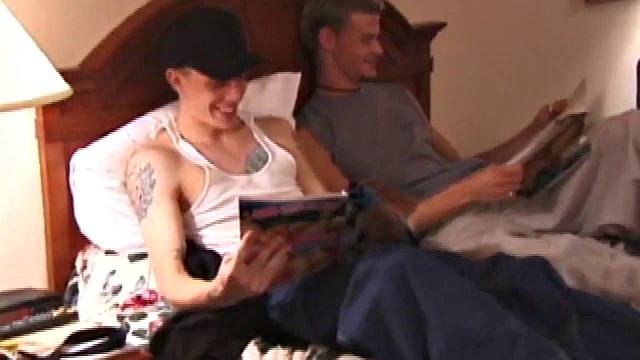 Derrick Hanson throws a porn magazine to Shane and keeps a magazine for himself. Lying on the hotel bed together they flip through the pictures of the magazines showing each other what pictures are turning them on.