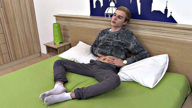 Kicked back on his bed, this blond twink is about to show us just how much he enjoys foot play, while jacking off. Stripped naked, young Erik Franke sucks his toes, as his cock hardens.