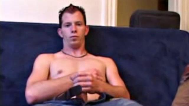 As a porn video plays, Raven strips naked and strokes his popping dick. He explodes an amazing cum load onto his chest.