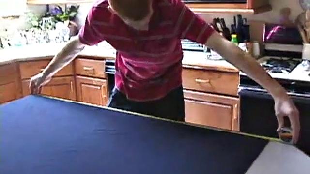 Always horny red haired skater Tristian covers the kitchen table with a large blue towel, stretches out a tape measure the length of the table, pulls out a porn magazine, tugs off his shirt, and gts down to business.