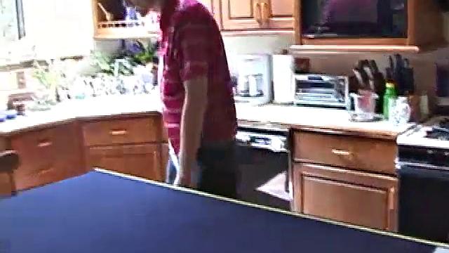 Always horny red haired skater Tristian covers the kitchen table with a large blue towel, stretches out a tape measure the length of the table, pulls out a porn magazine, tugs off his shirt, and gts down to business.