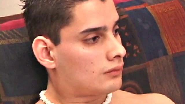 Travis Martinez starts out on the sofa to strip naked and get his cock hard. Then he strokes hard and makes his big balls bounce.