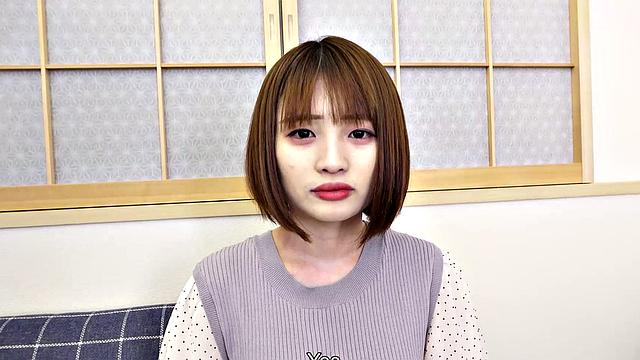 Japanese cafe worker Yuika Takigawa uses a sex toy to play.