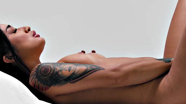 Inked babe solo fingering herself after interview