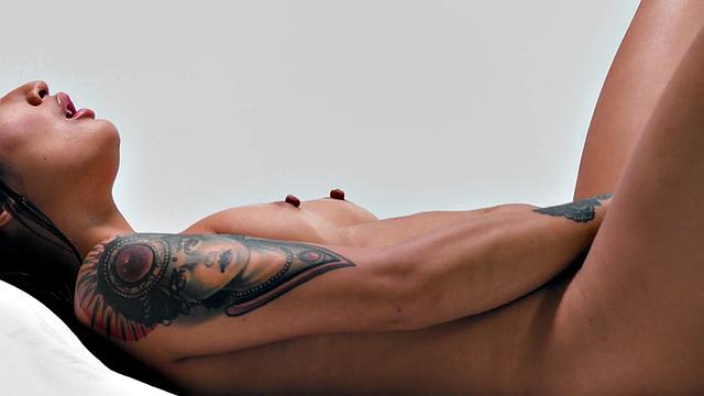 Inked babe solo fingering herself after interview